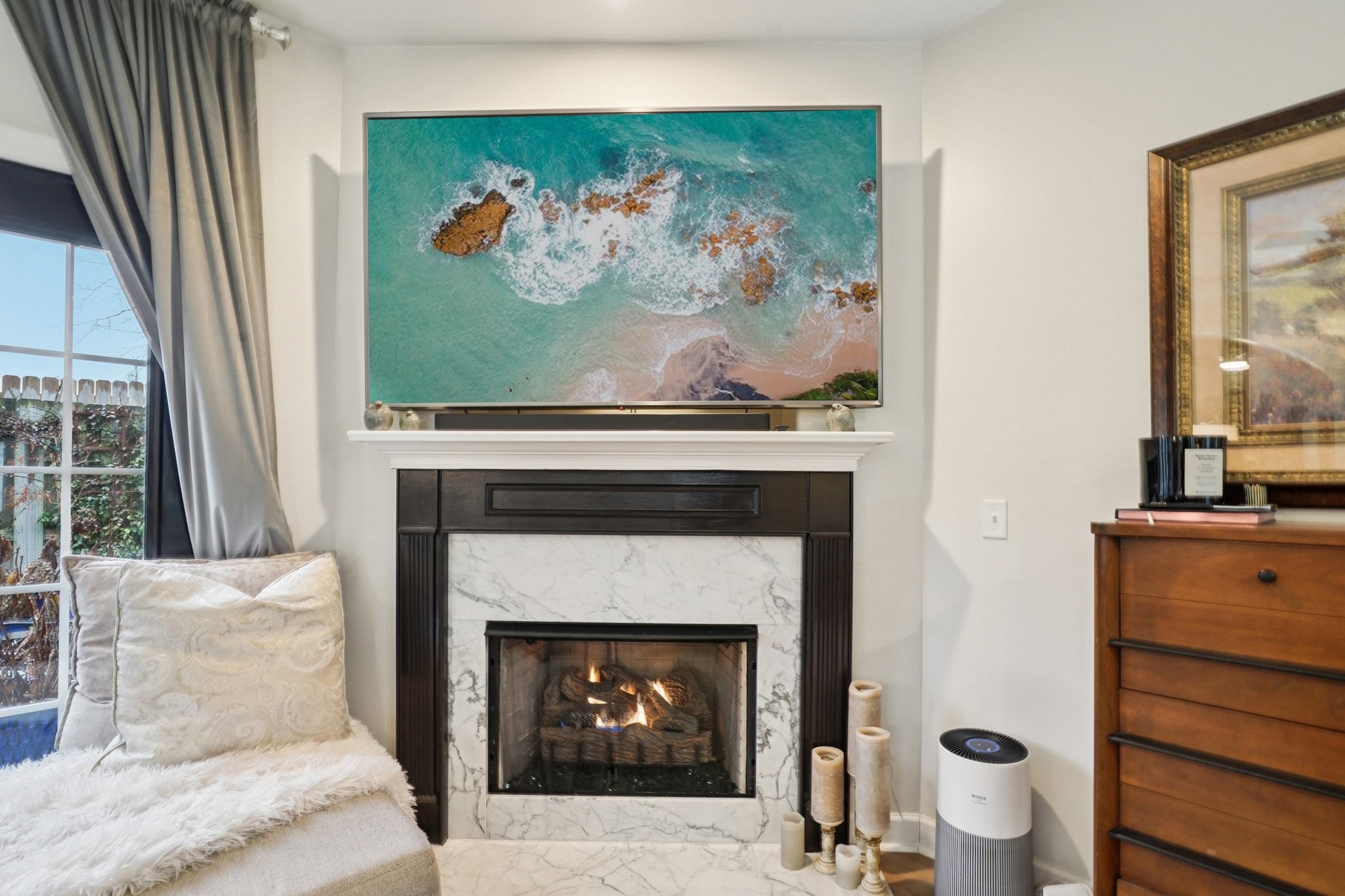 2521 Pennington Bend Road, Unit 206 Nashville, TN 37214 - Photo 6 of 34 a living room with a fireplace and a painting on the wall