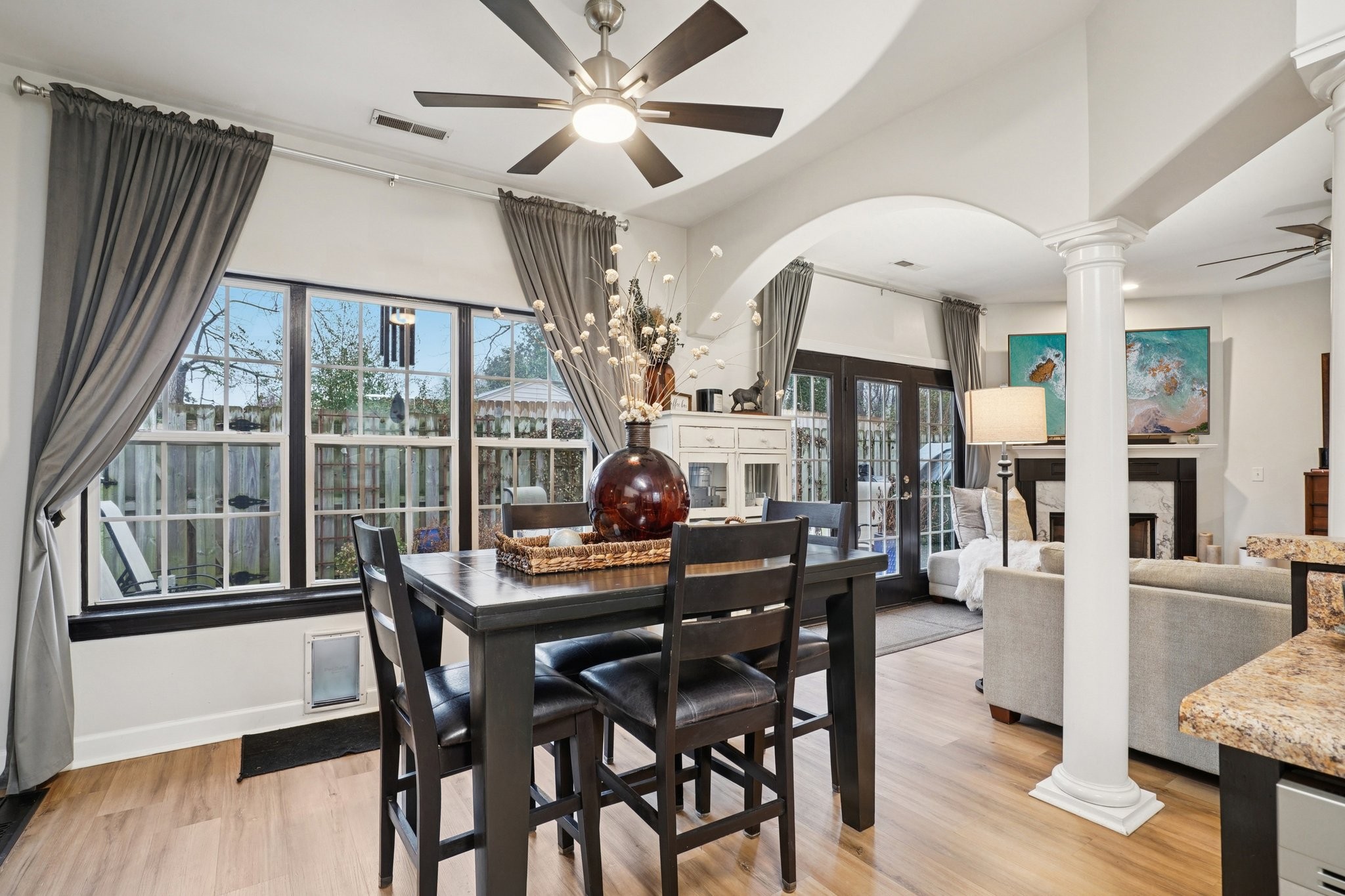 2521 Pennington Bend Road, Unit 206 Nashville, TN 37214 - Photo 8 of 34 a dining room with furniture a chandelier and wooden floor