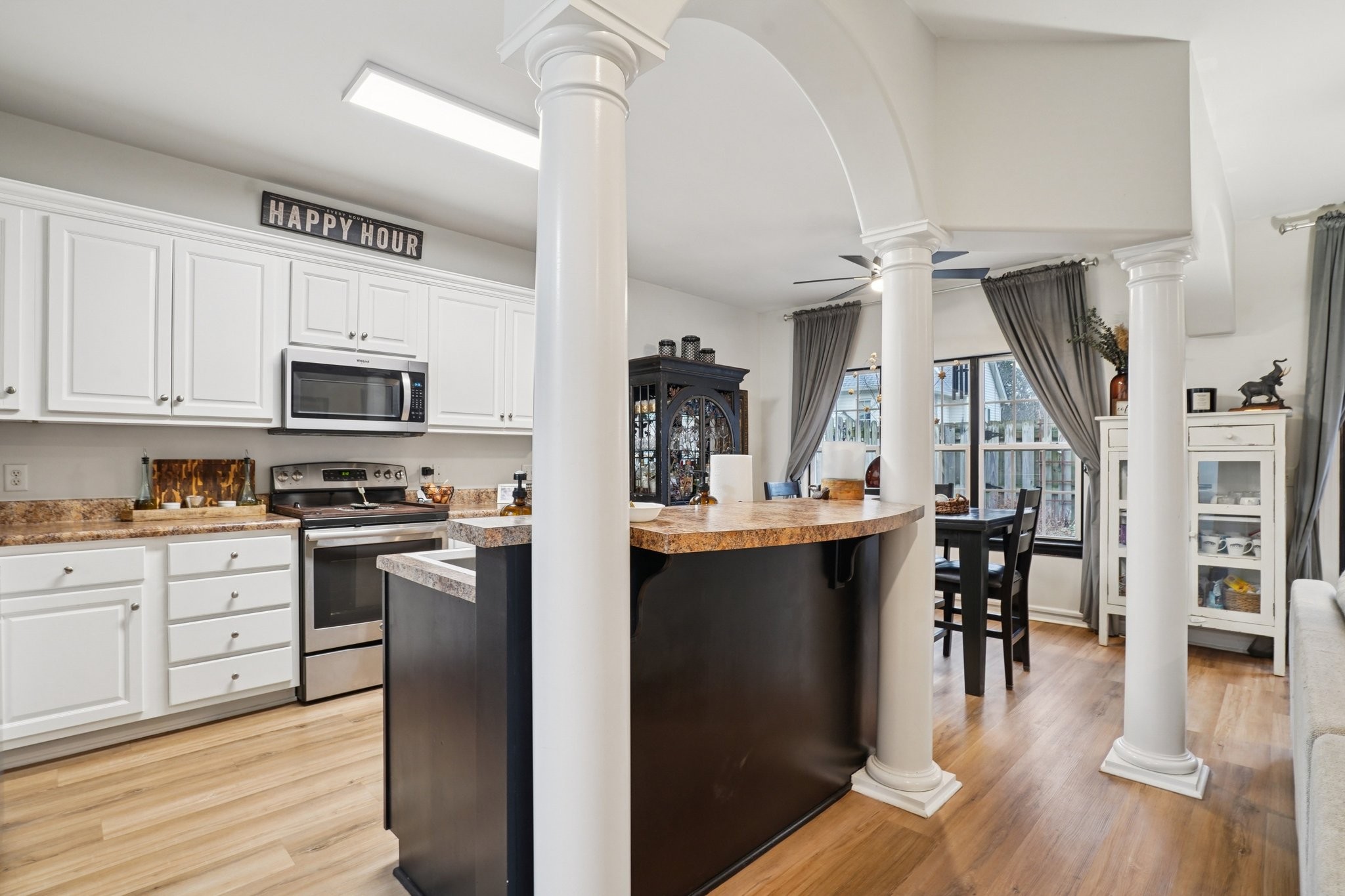 2521 Pennington Bend Road, Unit 206 Nashville, TN 37214 - Photo 9 of 34 a kitchen with stainless steel appliances granite countertop a refrigerator a stove top oven a sink dishwasher and white cabinets with wooden floor