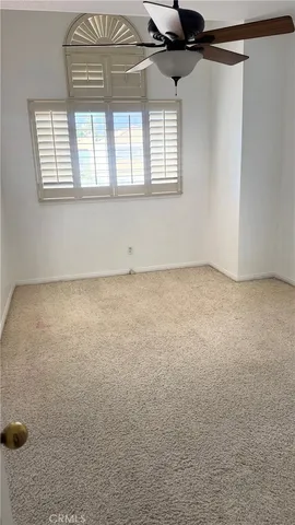 an empty room with a empty space and windows