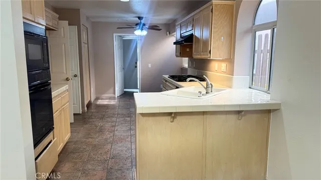 a bathroom with a sink a mirror and shower