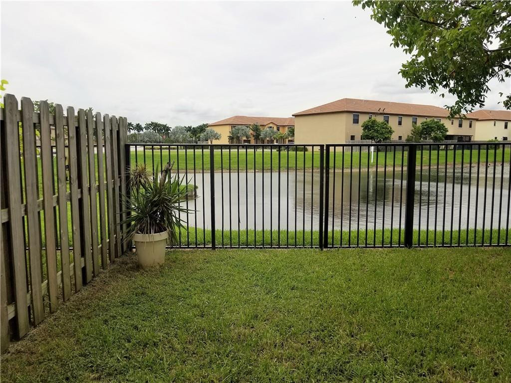 23952 Southwest 117 Place Homestead, FL 33032 - Photo 13 of 16 Fenced back patio and lake view