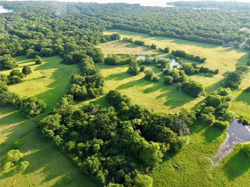 0 Double Bridge Road, Unit 2516 Mabank, TX 75156 - Photo 4 of 8 a view of a lake with a city