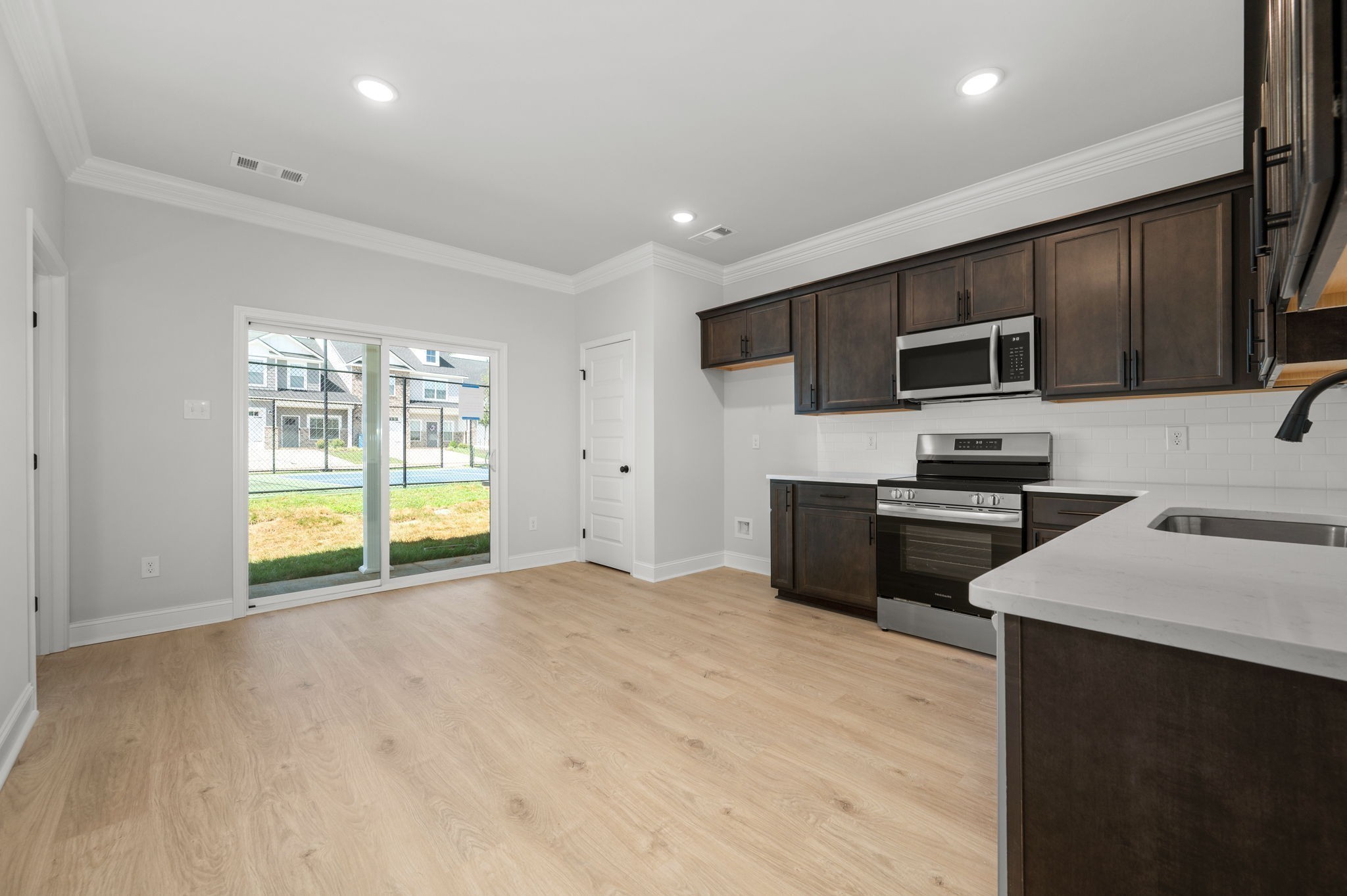 530 Rohan Drive Murfreesboro, TN 37129 - Photo 6 of 31 a kitchen with stainless steel appliances a stove sink microwave and refrigerator