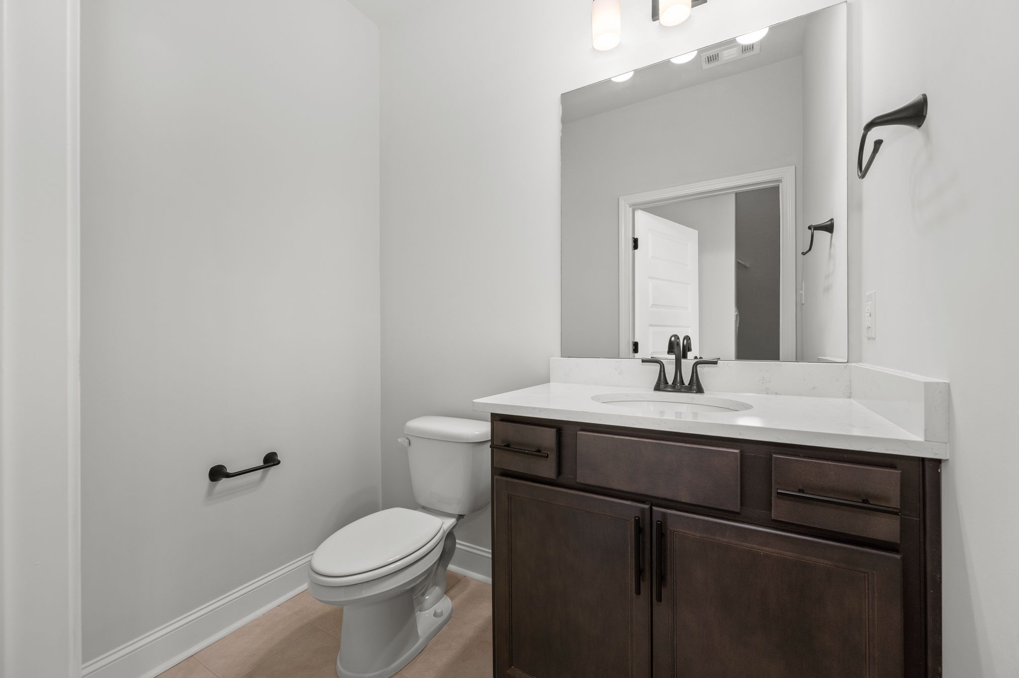530 Rohan Drive Murfreesboro, TN 37129 - Photo 9 of 31 a bathroom with a sink vanity mirror and toilet