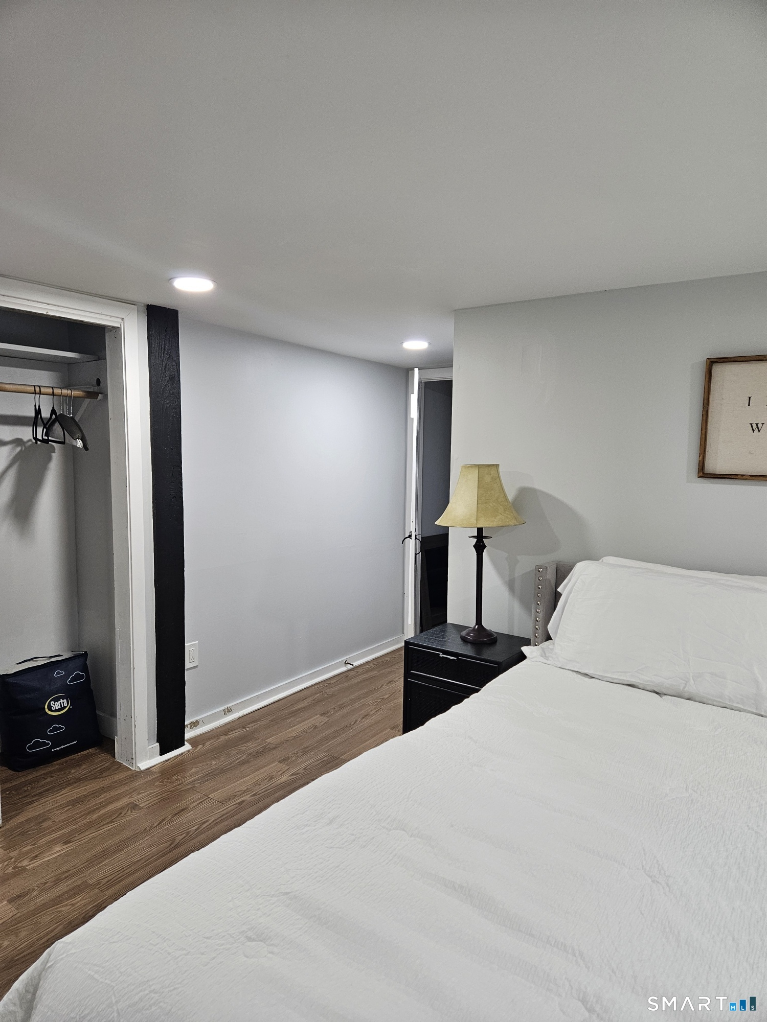 901 Baldwin Road Woodbridge, CT 06525 - Photo 12 of 27 a bedroom with a bed and wall painting