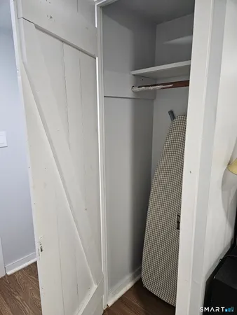 a view of a room with closet and wooden floor