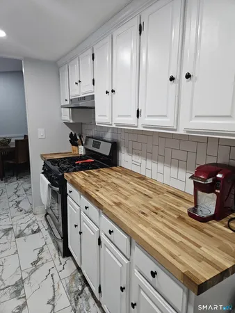 a living room with furniture fireplace and flat screen tv