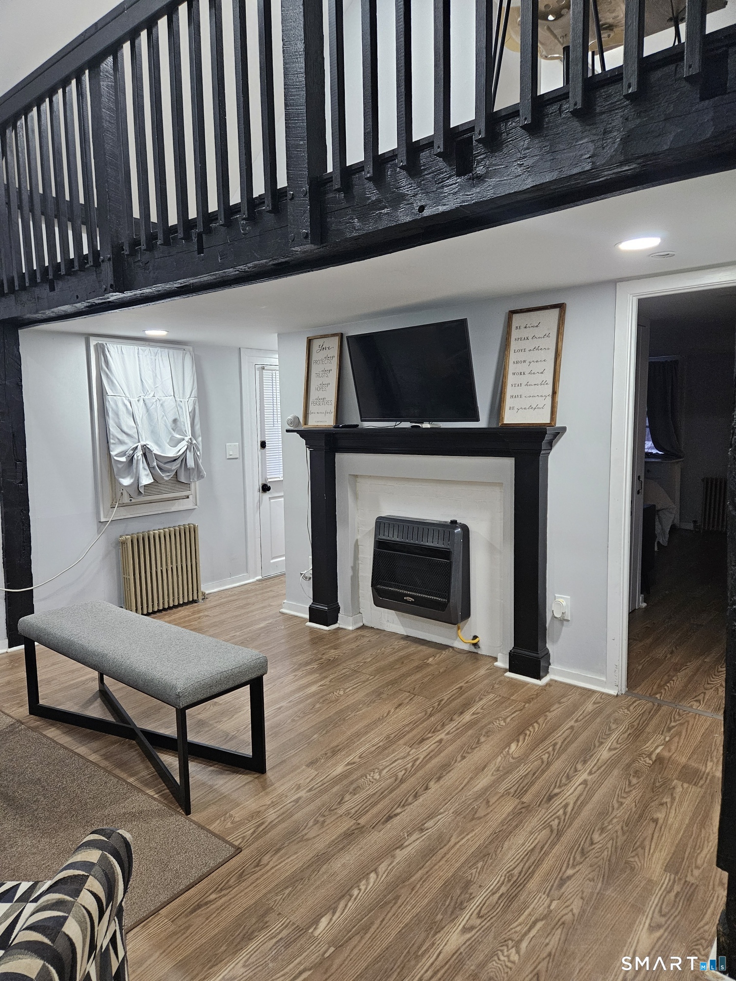 901 Baldwin Road Woodbridge, CT 06525 - Photo 17 of 27 a living room with furniture fireplace and flat screen tv