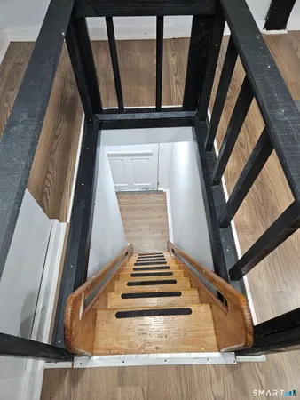 a bedroom with a bed and painted wall