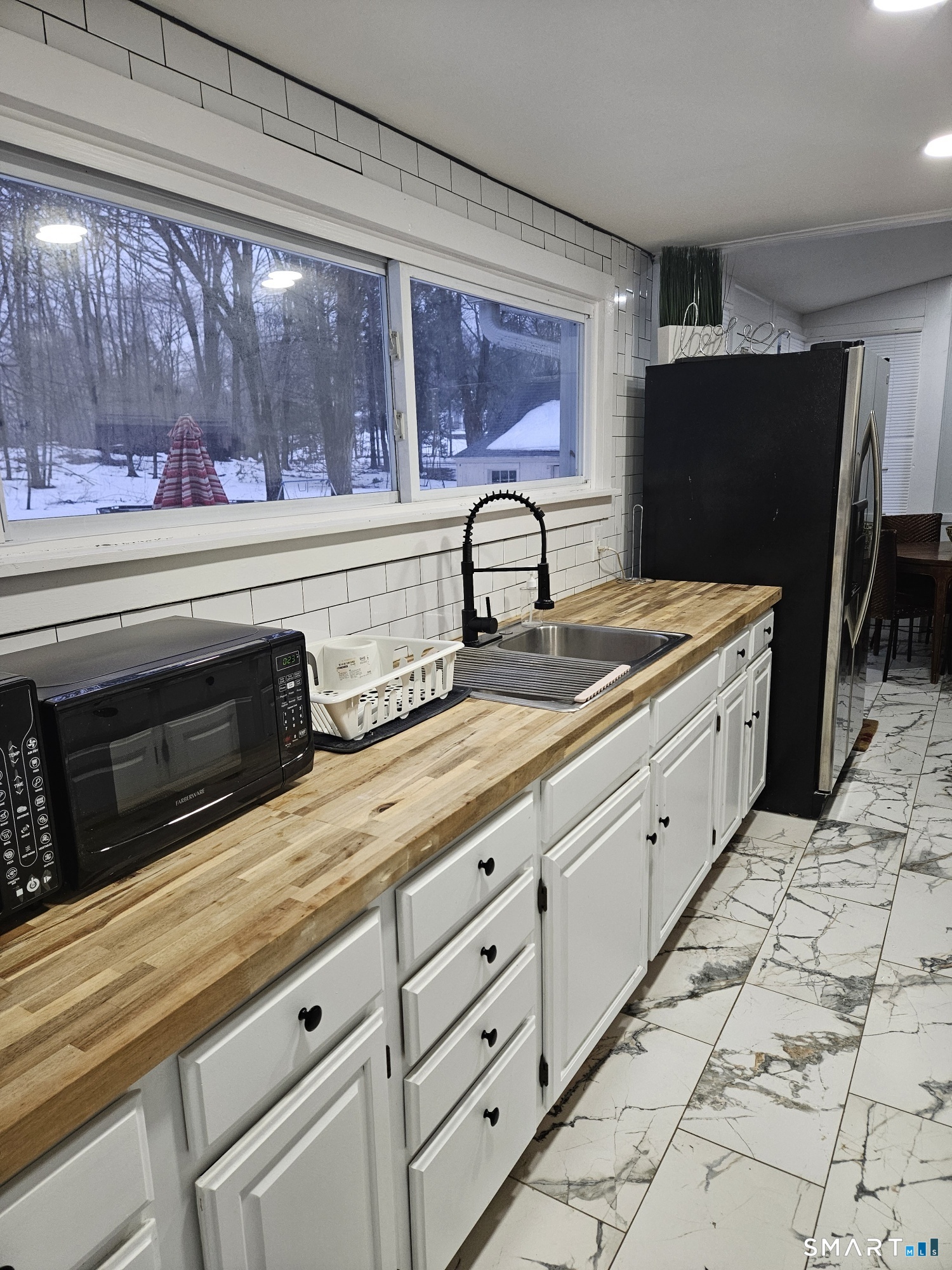 901 Baldwin Road Woodbridge, CT 06525 - Photo 6 of 27 a kitchen with granite countertop a sink and a stove top oven
