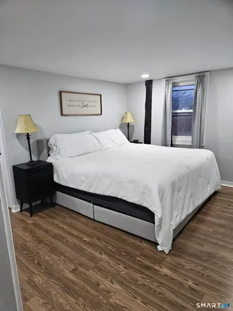 a bed room with a bed and a dresser