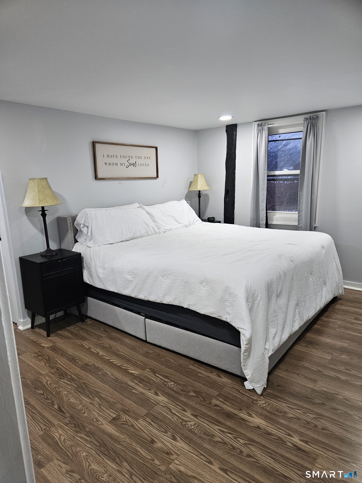 901 Baldwin Road Woodbridge, CT 06525 - Photo 10 of 27 a bedroom with a bed and wooden floor