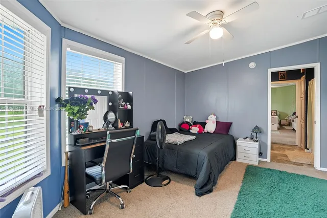 a bedroom with a bed and a mirror