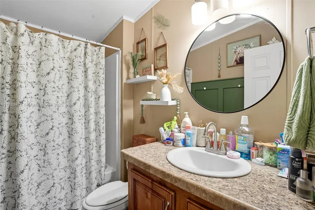a white refrigerator freezer sitting inside of a kitchen