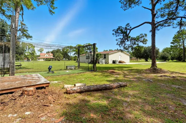 a view of a park with a house