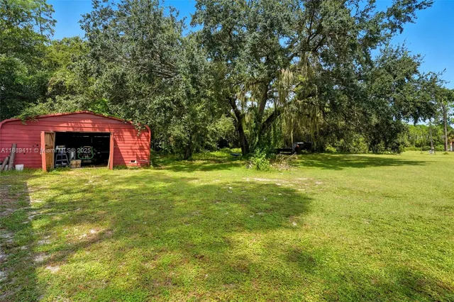 a backyard of a building with lots of green space