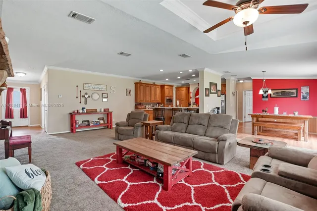 a view of a workspace with furniture and chandelier