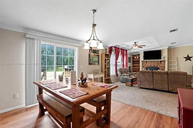 a living room with furniture a rug and a table