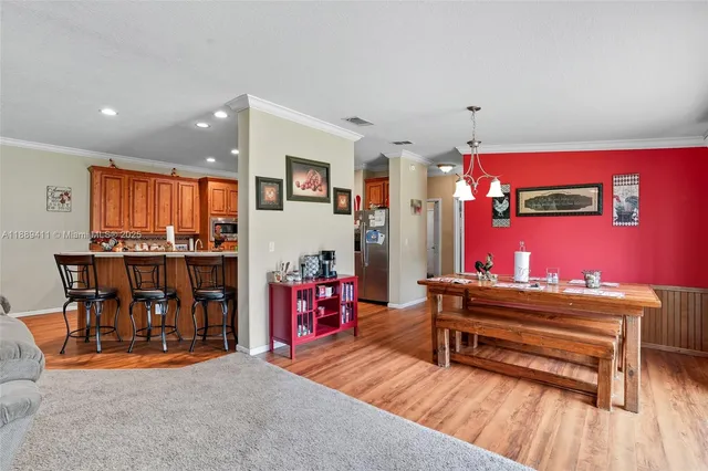 a view of a living room kitchen and dining room
