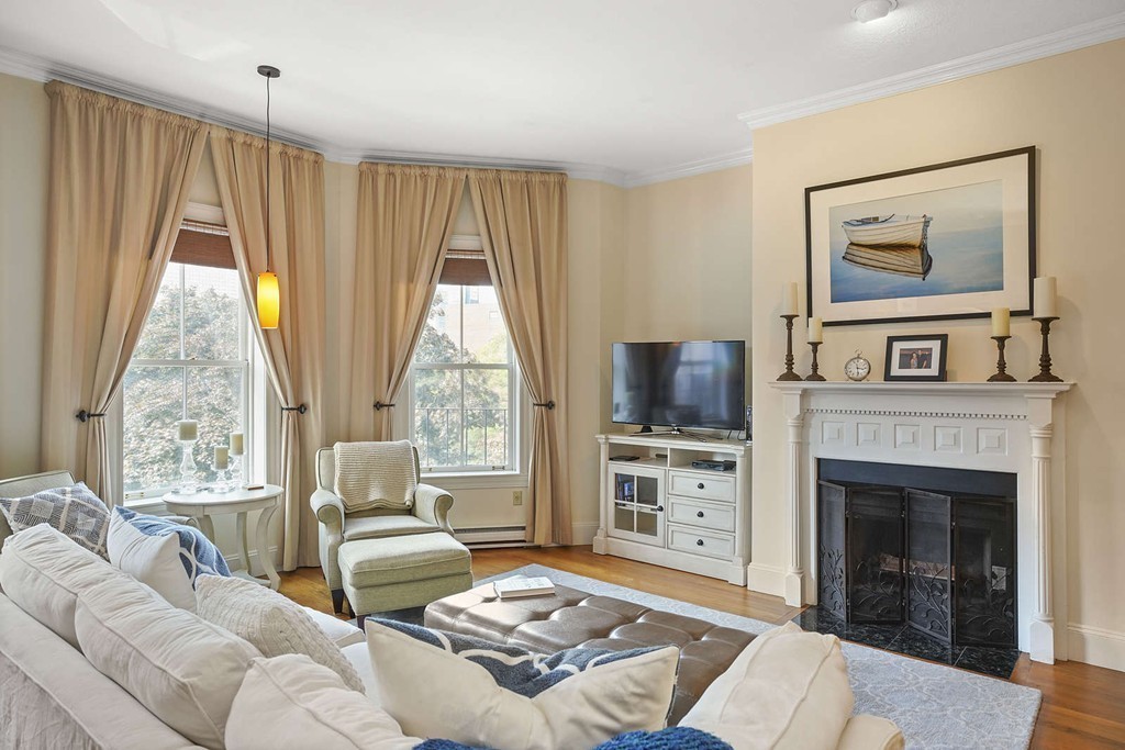 6 Columbus Square, Unit 3 Boston, MA 02116 - Photo 1 of 16 a living room with furniture and a fireplace