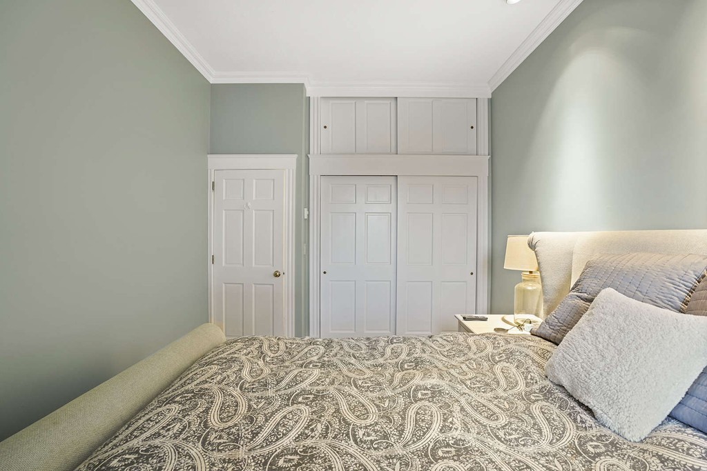 6 Columbus Square, Unit 3 Boston, MA 02116 - Photo 12 of 16 a bedroom with a bed and a white cabinet