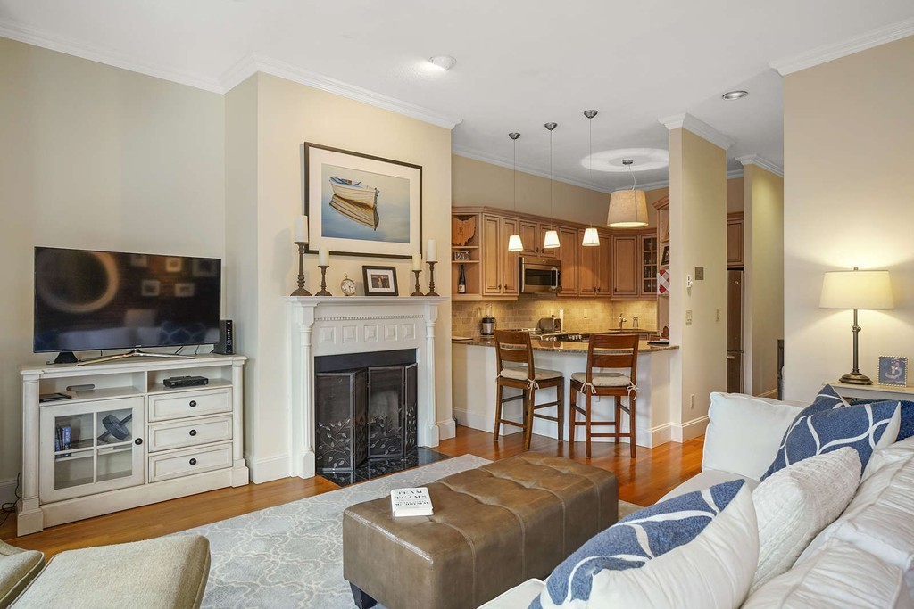 6 Columbus Square, Unit 3 Boston, MA 02116 - Photo 3 of 16 a living room with furniture and a fireplace