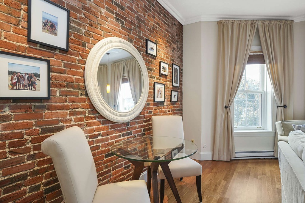 6 Columbus Square, Unit 3 Boston, MA 02116 - Photo 5 of 16 a living room with furniture and a window