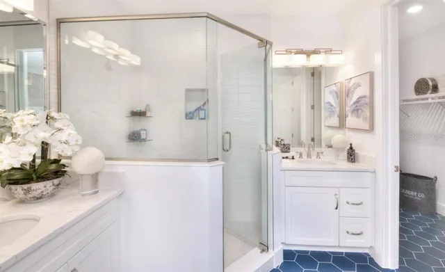 a bathroom with a bathtub sink and mirror