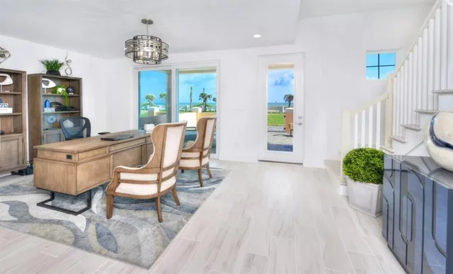 a dining room with furniture and a floor to ceiling window