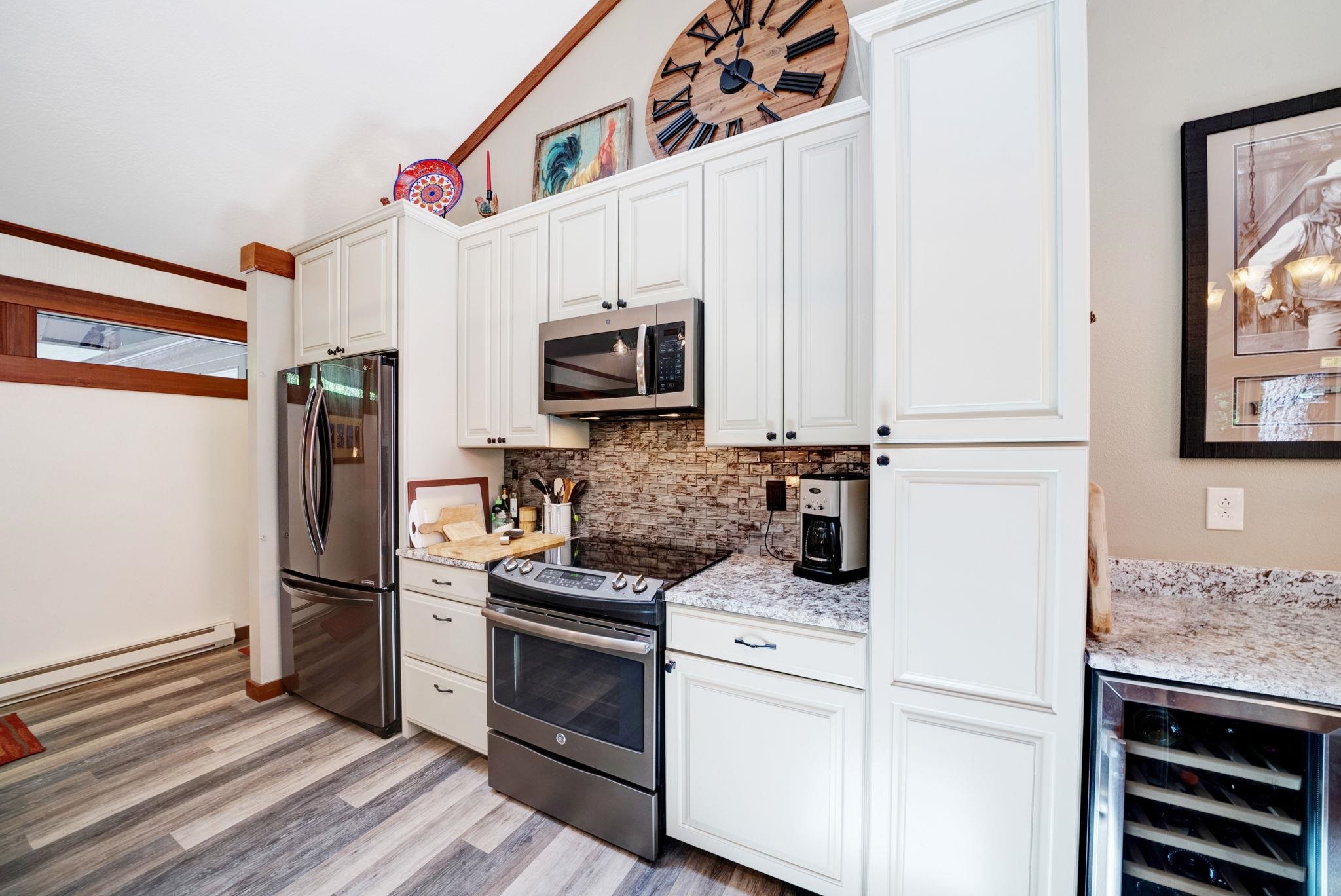 50 Graeagle Meadows Road Graeagle, CA 96103 - Photo 13 of 39 a kitchen with a refrigerator stove and microwave