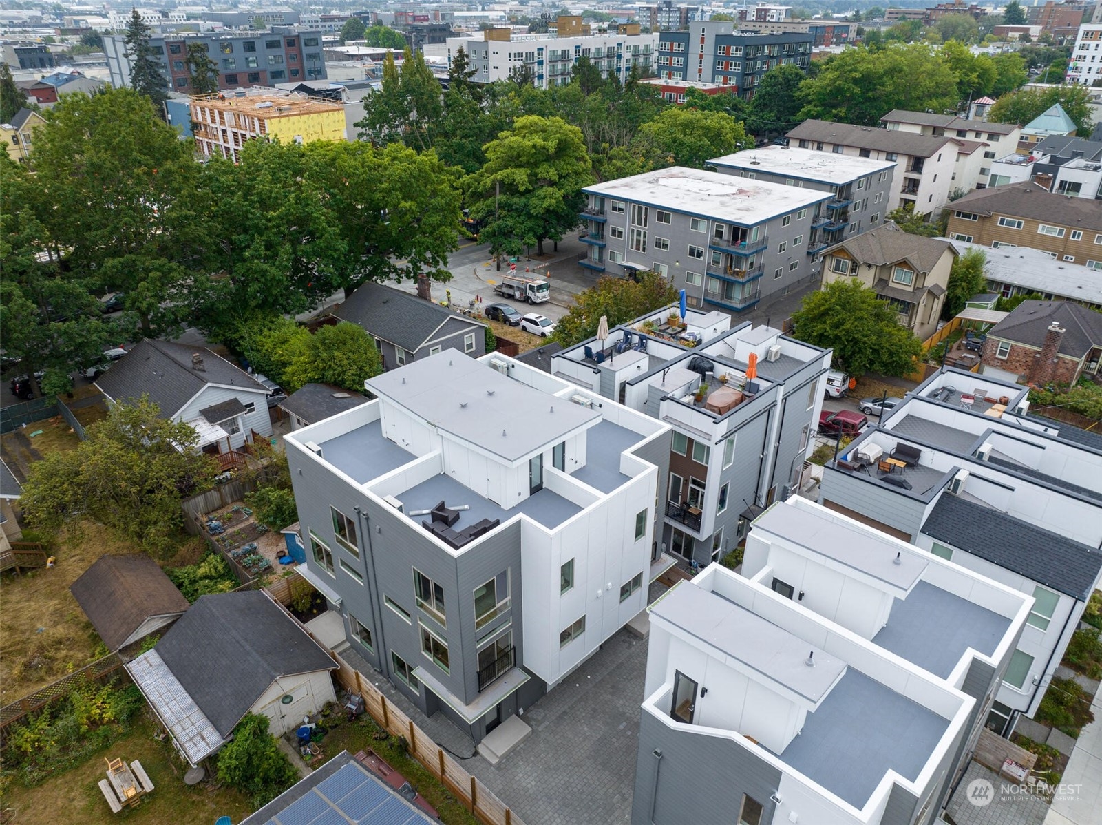 an aerial view of a house with a city street view