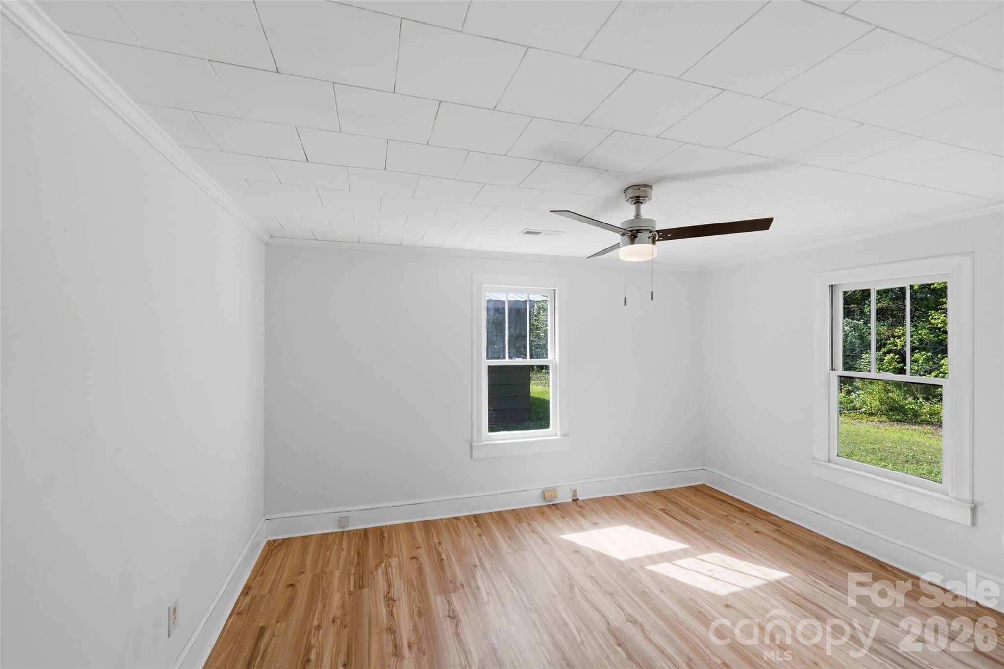 2231 Claremont Road Newton, NC 28658 - Photo 8 of 39 wooden floor in an empty room with a window
