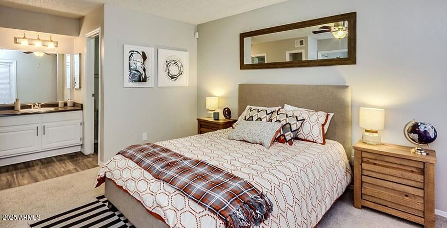 445 South Dobson Road, Unit A2 Mesa, AZ 85202 - Photo 3 of 7 a bedroom with a bed and a flat screen tv