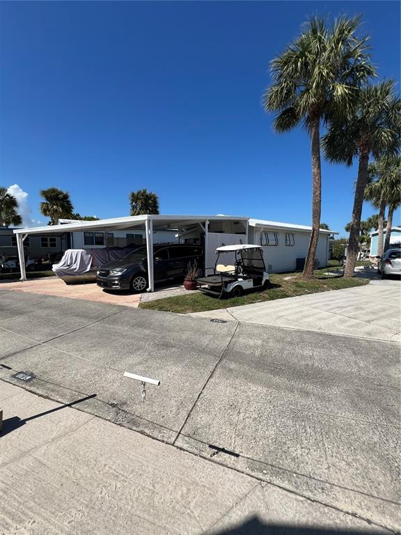 a view of a cars park on the side of road