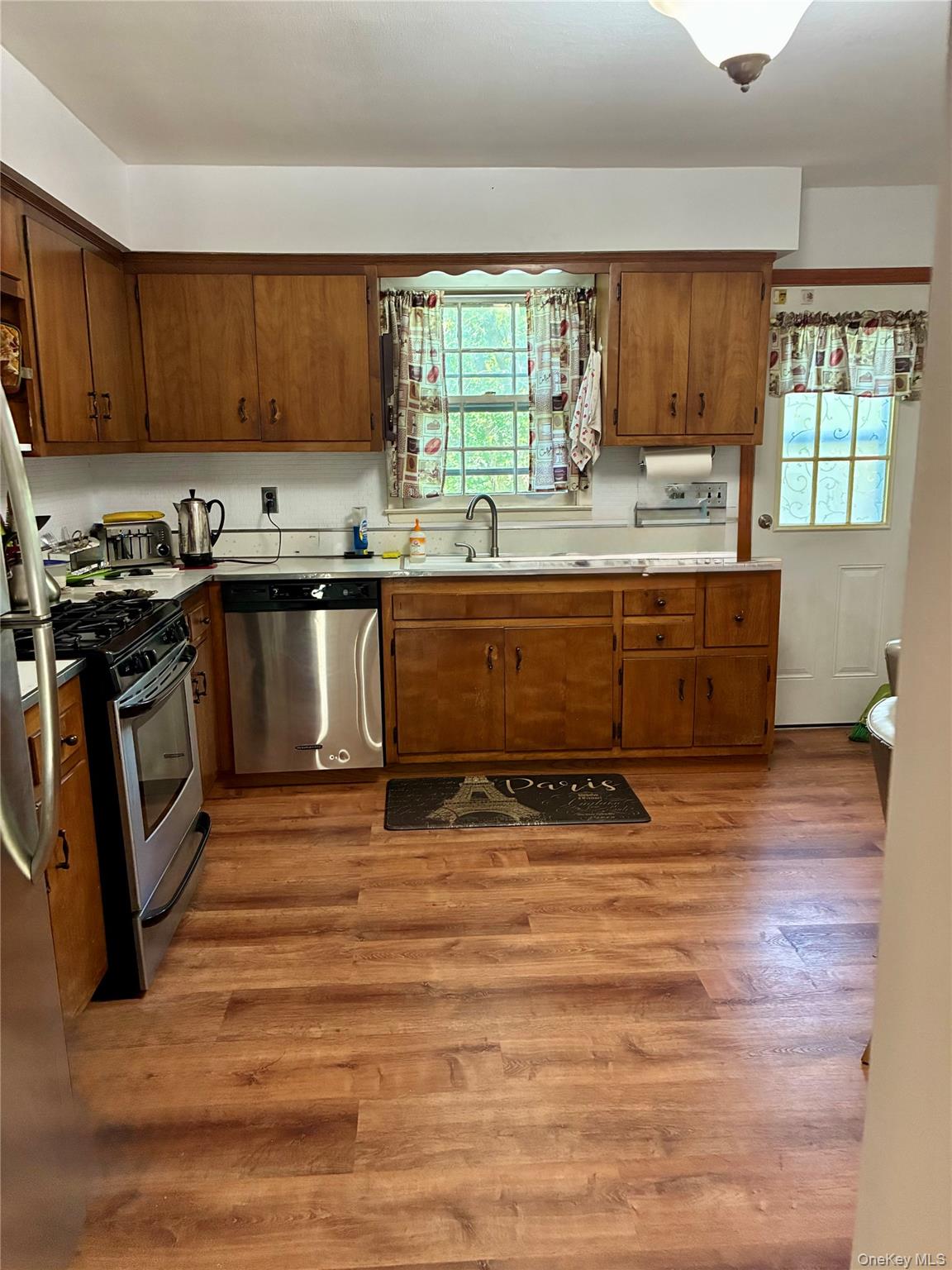 24 Ann Boulevard Spring Valley, NY 10977 - Photo 8 of 25 a kitchen with stainless steel appliances granite countertop a stove a sink and a microwave