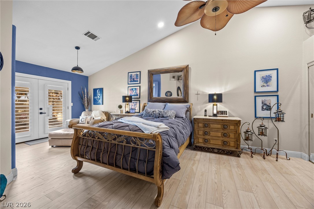 814 Manor Shores Road Henderson, NV 89002 - Photo 16 of 40 Soaring vaulted ceilings and durable wood-look flooring define this comfortable private retreat.