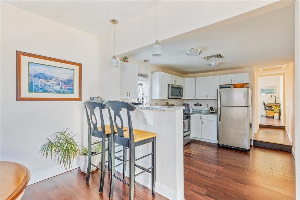 43 Fern Road Holbrook, MA 02343 - Photo 11 of 20 a view of kitchen with furniture and wooden floor
