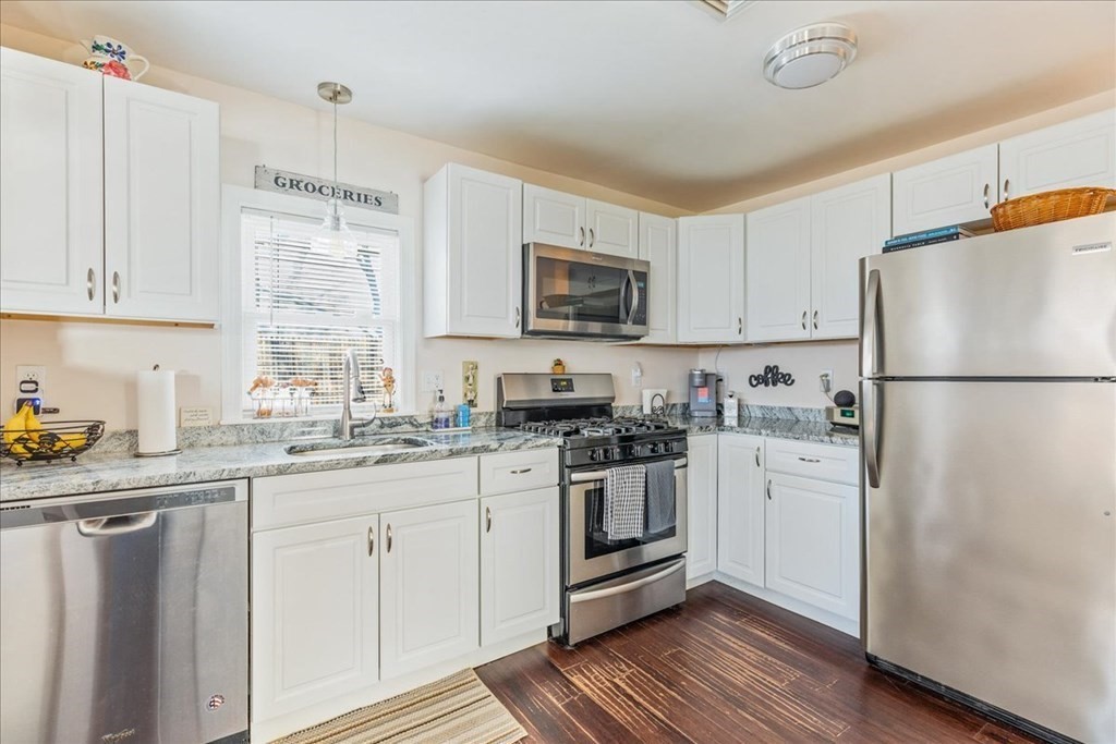 43 Fern Road Holbrook, MA 02343 - Photo 12 of 20 a kitchen with stainless steel appliances granite countertop a refrigerator stove a sink and a microwave