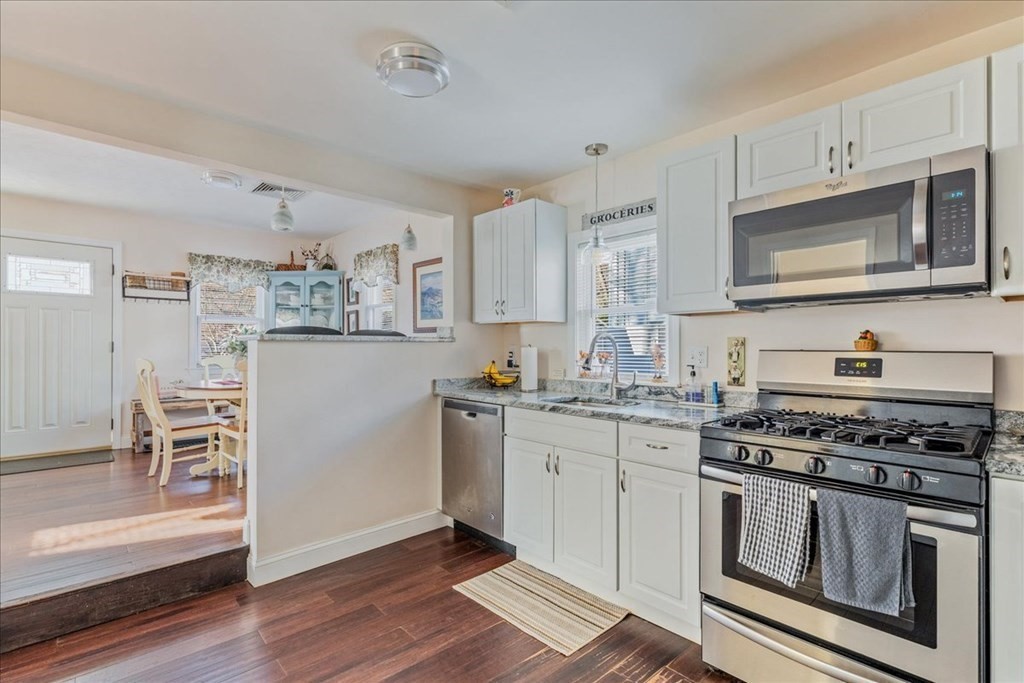 43 Fern Road Holbrook, MA 02343 - Photo 13 of 20 a kitchen with stainless steel appliances a stove microwave and cabinets