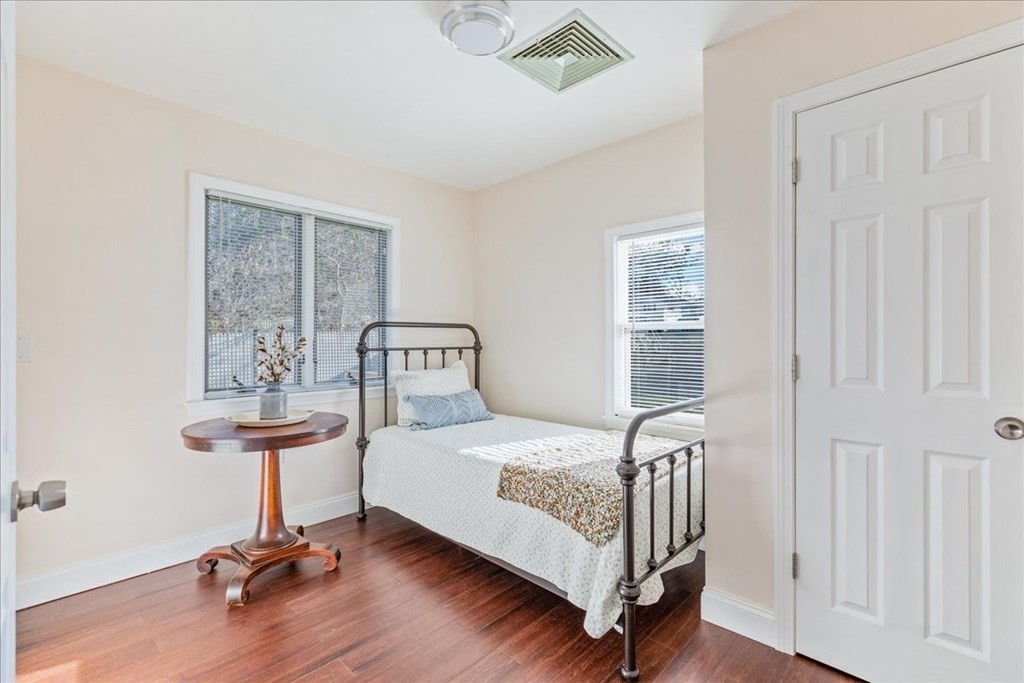 43 Fern Road Holbrook, MA 02343 - Photo 16 of 20 a bedroom with a bed and a table