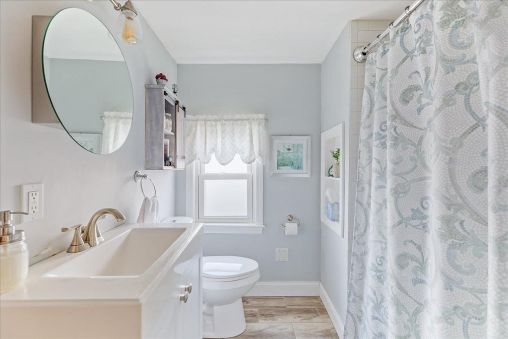 43 Fern Road Holbrook, MA 02343 - Photo 17 of 20 a bathroom with a sink and a mirror