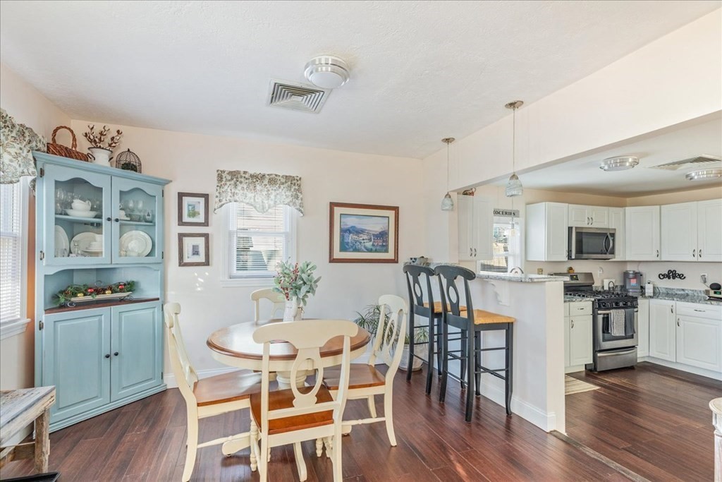 43 Fern Road Holbrook, MA 02343 - Photo 9 of 20 a view of a dining room with furniture and wooden floor