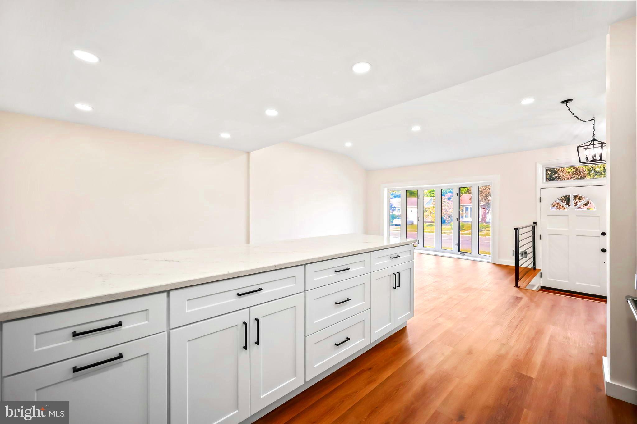 61 Argonne Avenue Hamilton, NJ 08620 - Photo 15 of 38 a spacious bathroom with stainless steel appliances a large counter top and a wooden floors