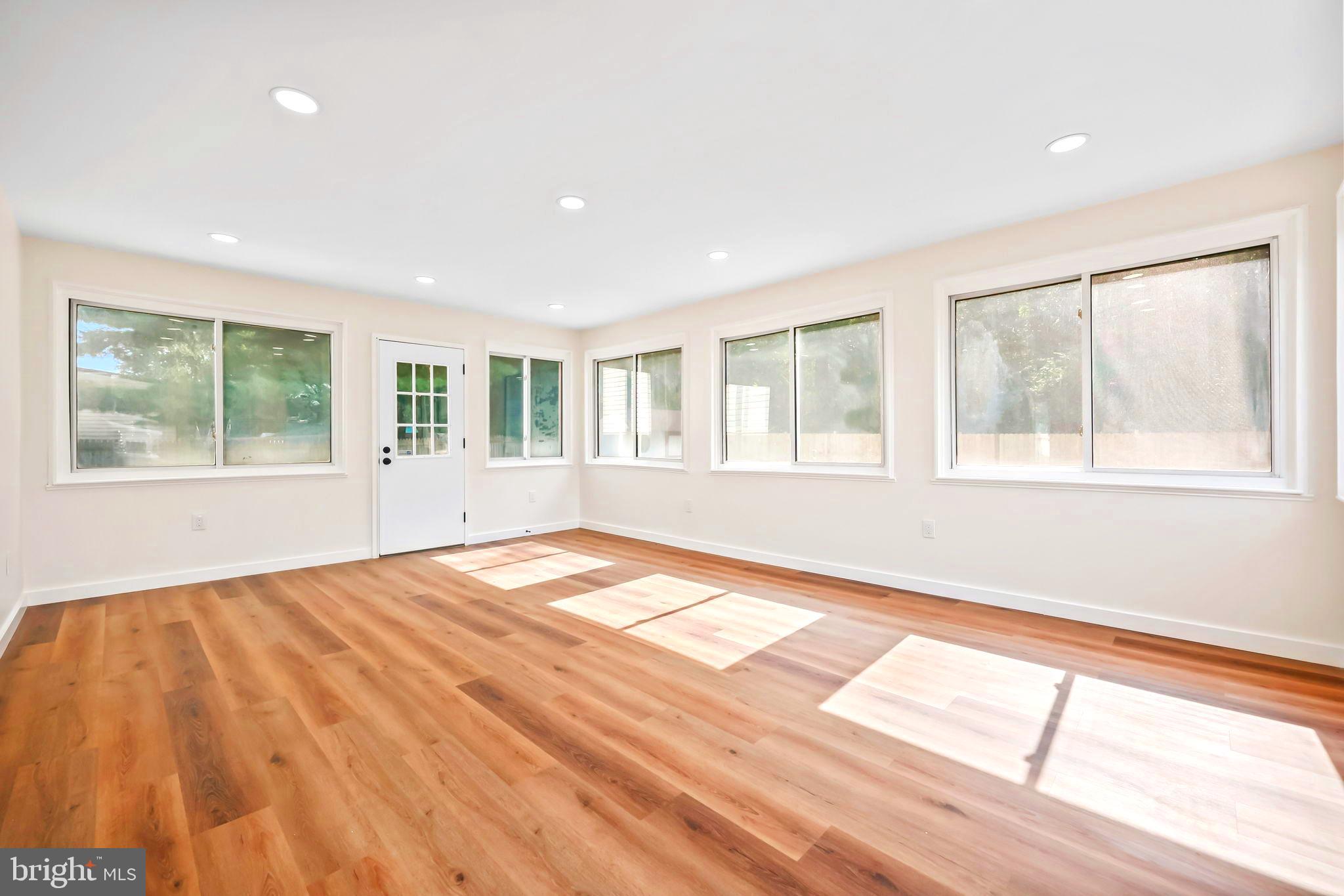 61 Argonne Avenue Hamilton, NJ 08620 - Photo 18 of 38 a view of empty room with wooden floor and fan