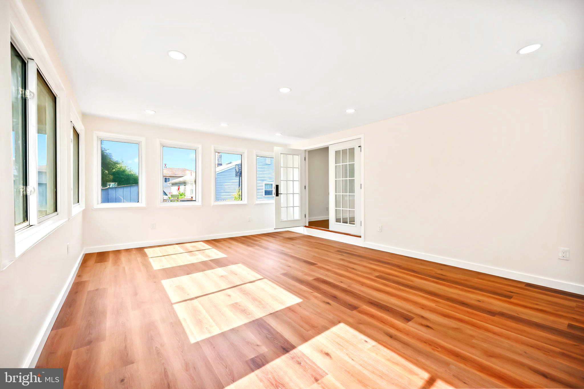 61 Argonne Avenue Hamilton, NJ 08620 - Photo 19 of 38 a view of an empty room with wooden floor and a window