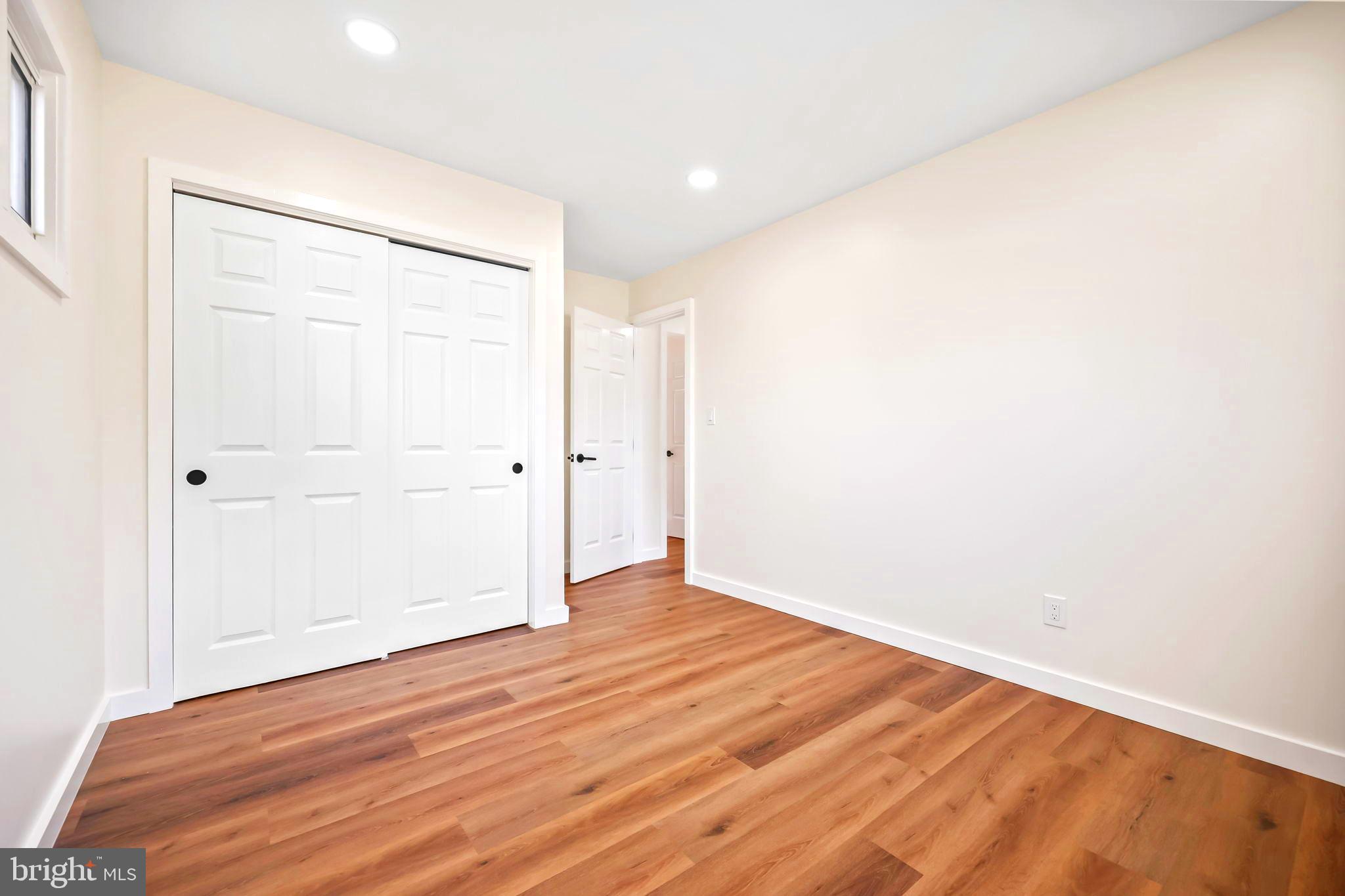61 Argonne Avenue Hamilton, NJ 08620 - Photo 26 of 38 an empty room with wooden floor