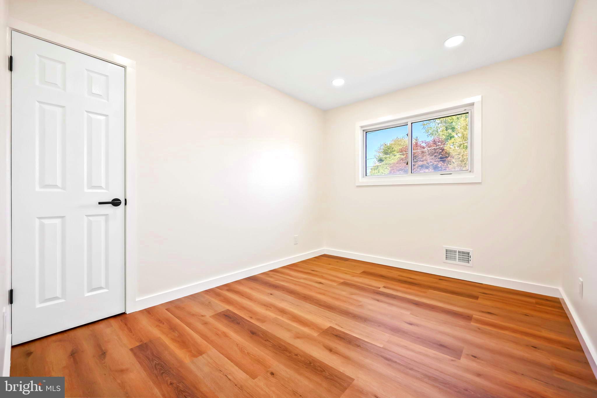 61 Argonne Avenue Hamilton, NJ 08620 - Photo 27 of 38 an empty room with wooden floor and closet