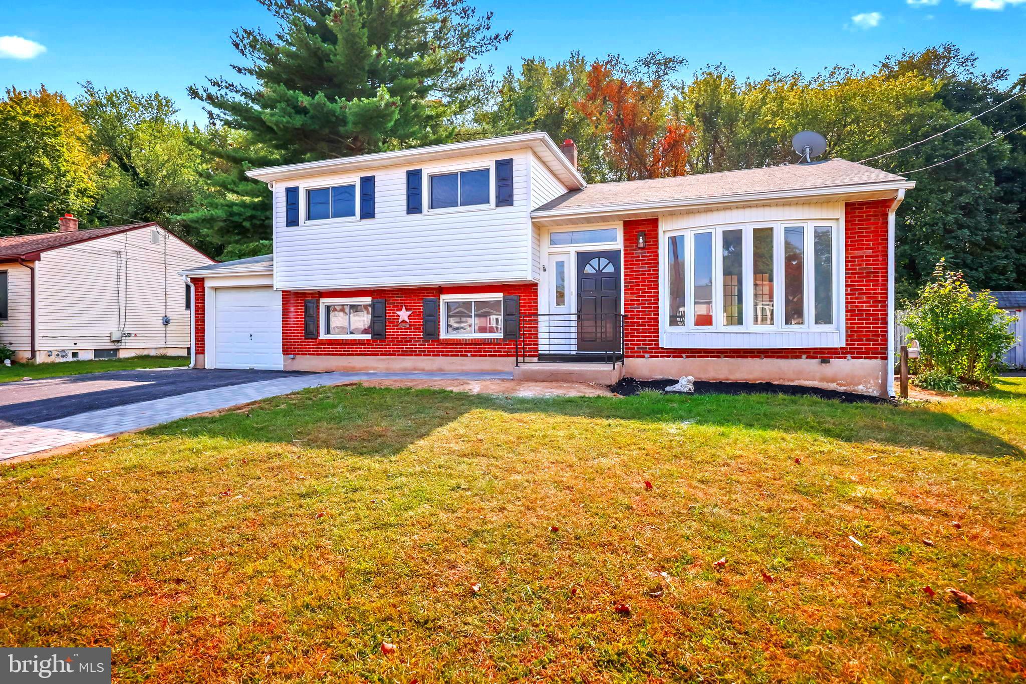 61 Argonne Avenue Hamilton, NJ 08620 - Photo 3 of 38 a front view of a house with garden