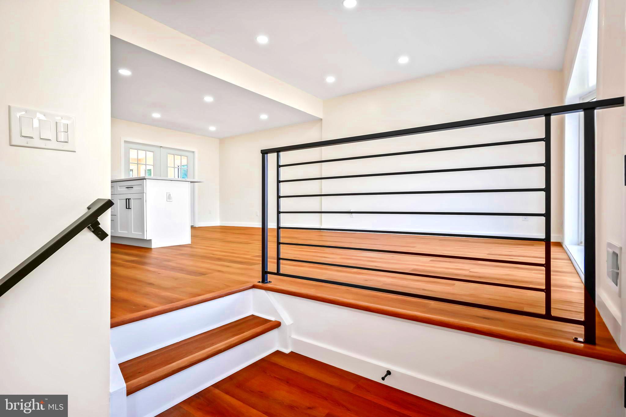 61 Argonne Avenue Hamilton, NJ 08620 - Photo 5 of 38 a view of room with stairs and wooden floor